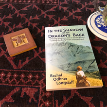 one copy of paperback on table with carpet